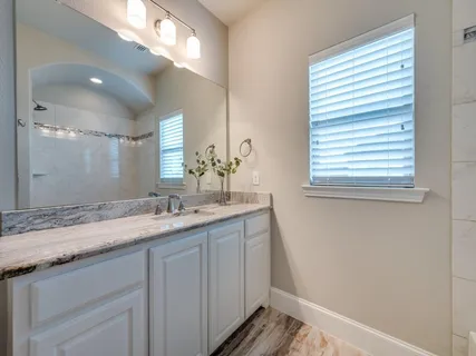 a view of an empty room with entrance and door
