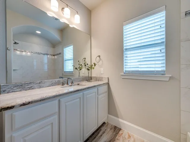 a view of an empty room with entrance and door