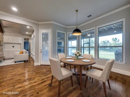 a kitchen with kitchen island a counter space a sink appliances and cabinets