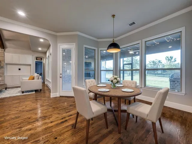 a kitchen with kitchen island a counter space a sink appliances and cabinets