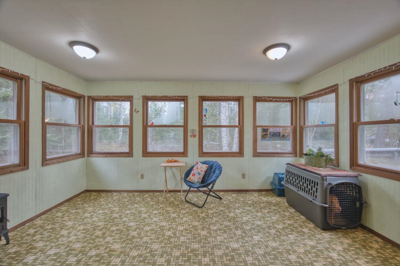 5462 Twin Lakes Loop 45 Aurora, MN 55705 - Photo 2 of 42 Unfurnished sunroom featuring carpet floors