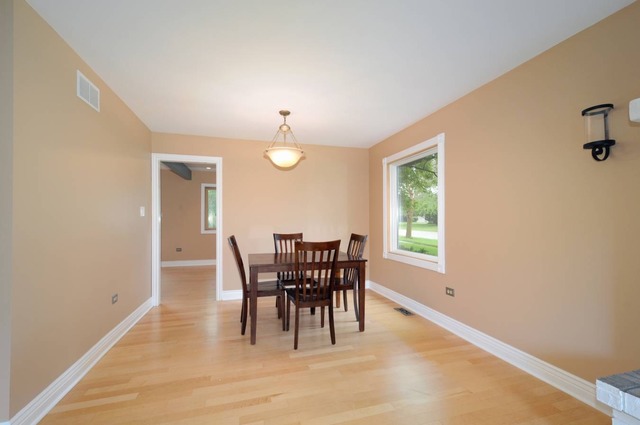 298 Mulberry Road Frankfort, IL 60423 - Photo 5 of 10 a view of a dining room with furniture window and wooden floor