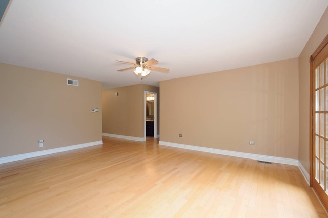 298 Mulberry Road Frankfort, IL 60423 - Photo 7 of 10 an empty room with chandelier fan