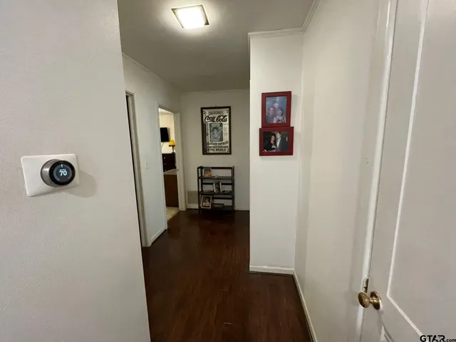 a view of a hardwood and hallway