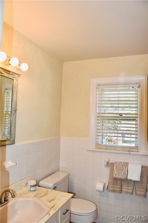 4010 Falstone Road Richmond, VA 23234 - Photo 15 of 19 a bathroom with a sink a toilet and a mirror