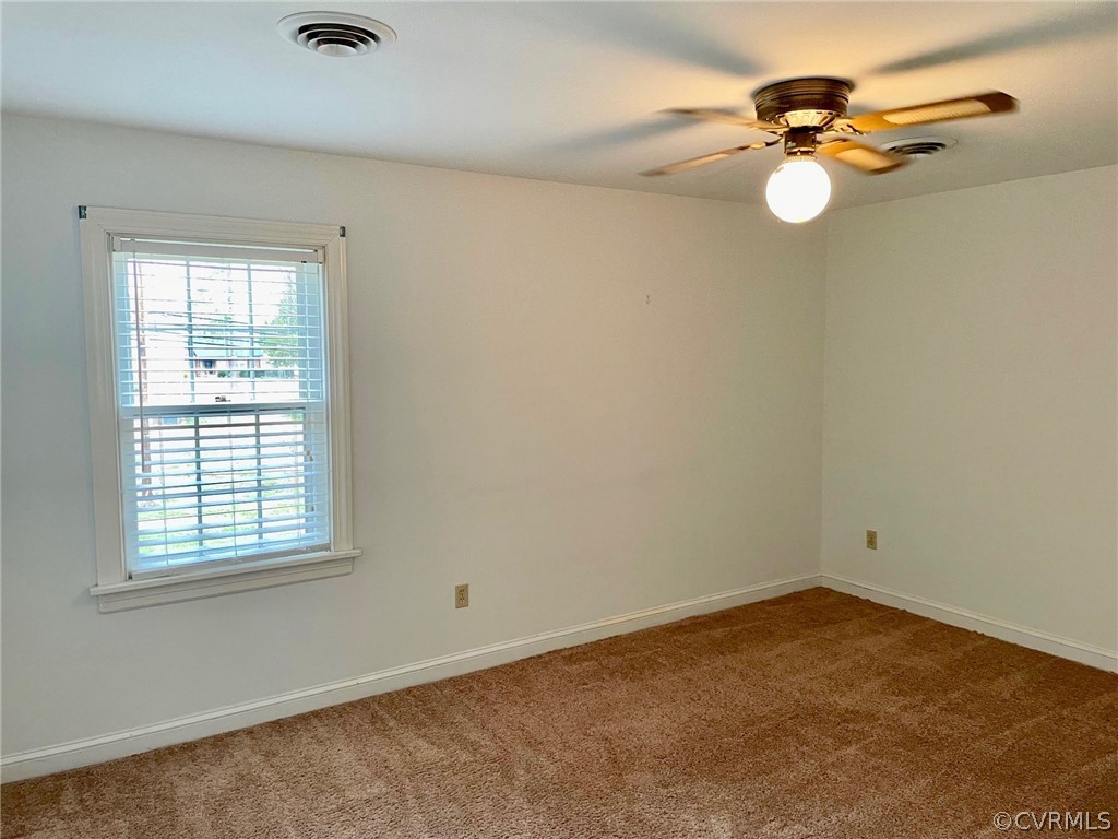 4010 Falstone Road Richmond, VA 23234 - Photo 18 of 19 an empty room with a window
