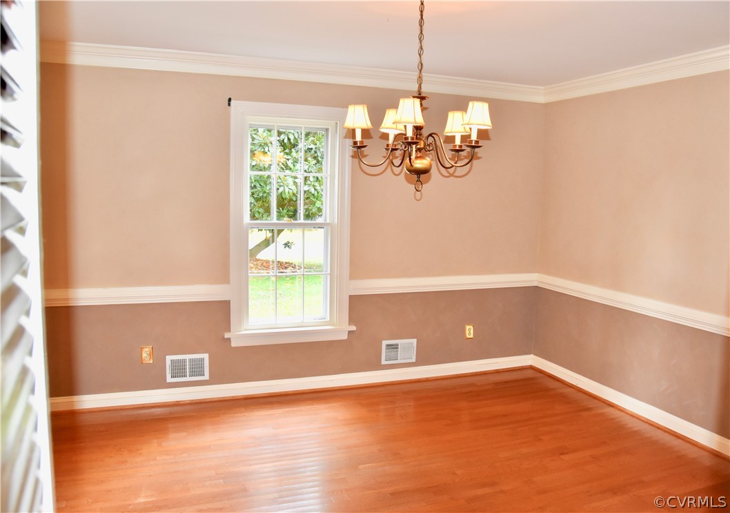 4010 Falstone Road Richmond, VA 23234 - Photo 4 of 19 a view of empty room with wooden floor and fan