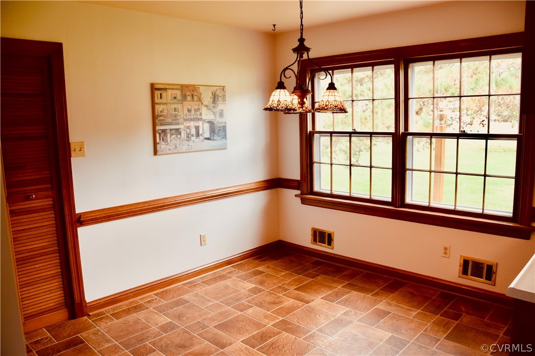 4010 Falstone Road Richmond, VA 23234 - Photo 7 of 19 a view of an empty room with a window