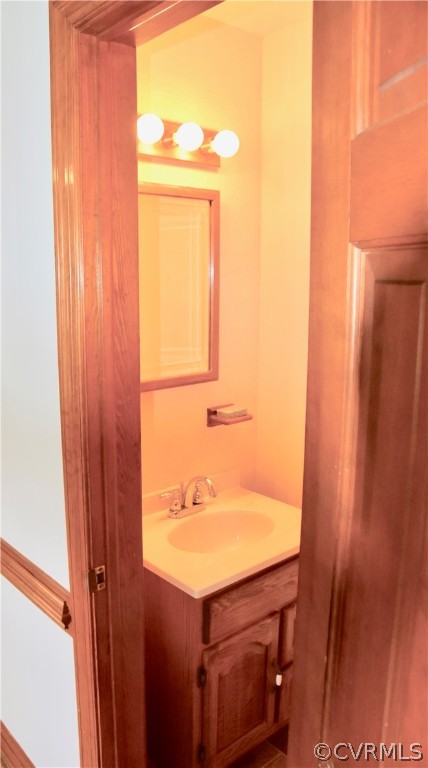 4010 Falstone Road Richmond, VA 23234 - Photo 8 of 19 a bathroom with a sink and a mirror