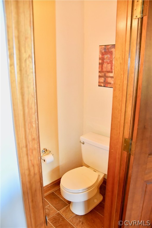 4010 Falstone Road Richmond, VA 23234 - Photo 9 of 19 a bathroom with a toilet and a shower curtain
