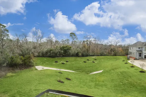 a view of a golf course with a lake