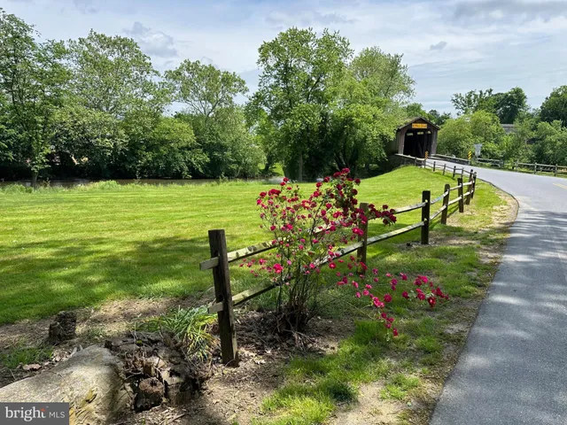 a view of a garden with sitting area