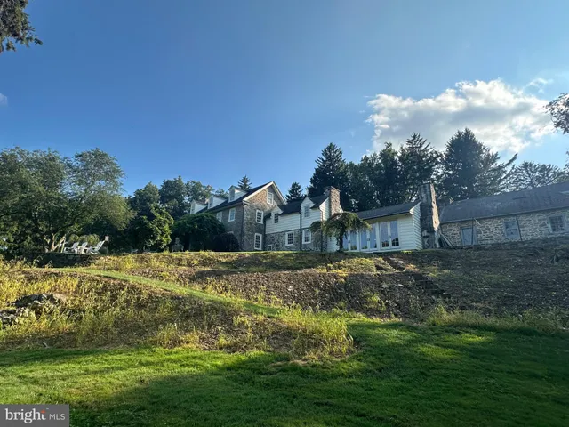 a view of a big yard with a house