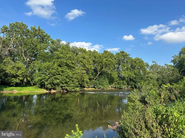 a view of lake with green space