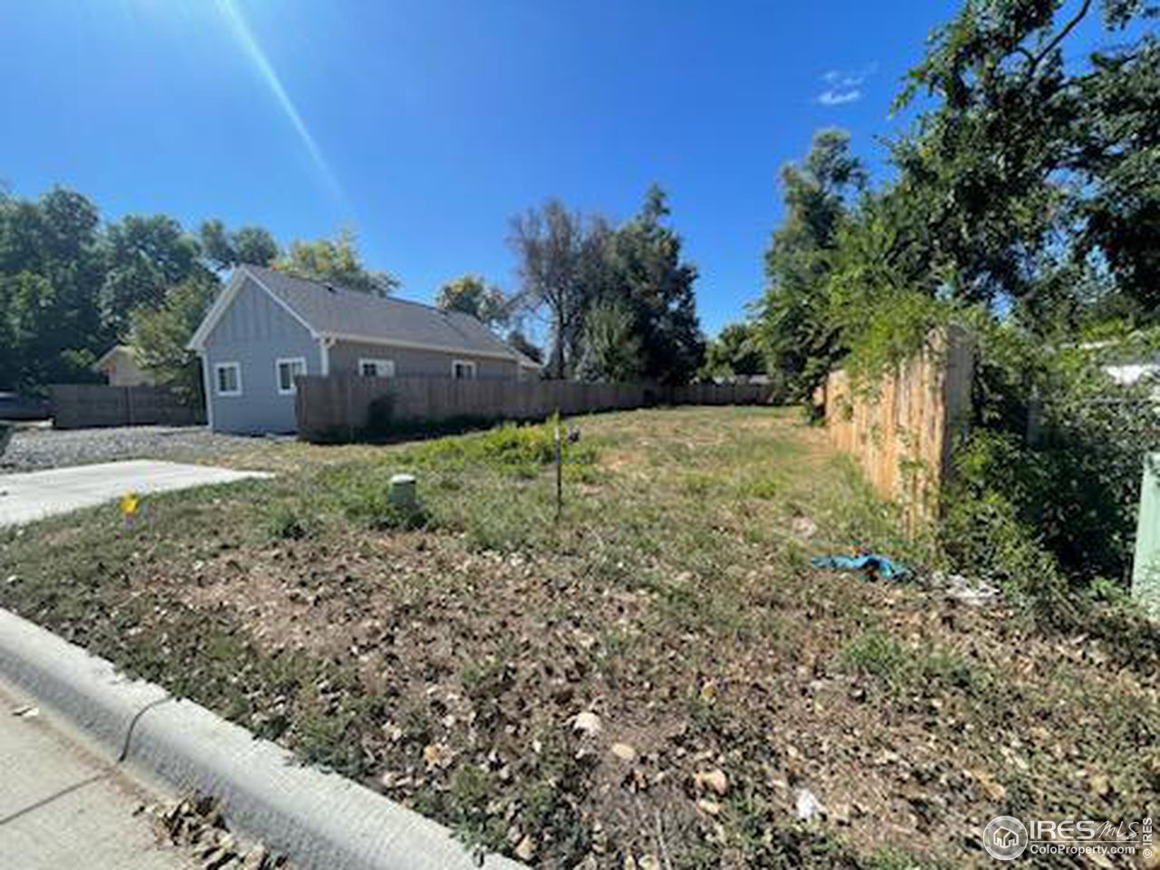 741 Lindenmeier Road Fort Collins, CO 80524 - Photo 3 of 5 a backyard of a house with lots of green space