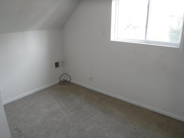 513 Pulaski Road Calumet City, IL 60409 - Photo 11 of 18 an empty room with a window
