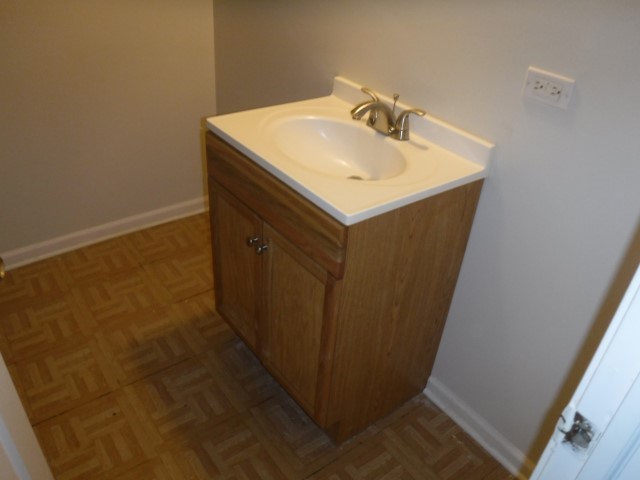 513 Pulaski Road Calumet City, IL 60409 - Photo 14 of 18 a bathroom with sink and mirror