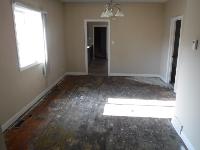 513 Pulaski Road Calumet City, IL 60409 - Photo 4 of 18 an empty room with windows