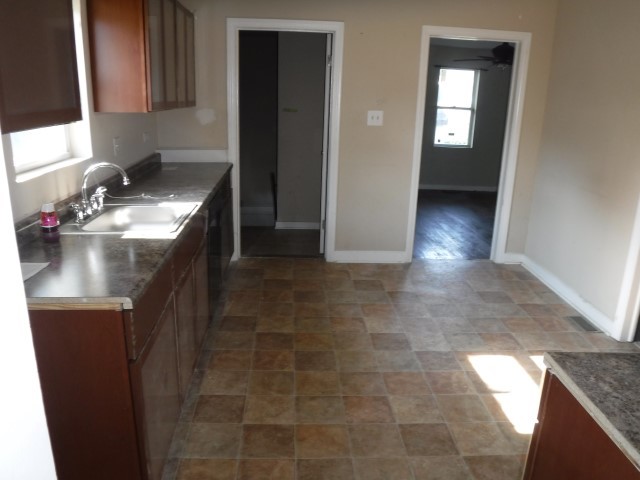 513 Pulaski Road Calumet City, IL 60409 - Photo 5 of 18 a kitchen with a sink and cabinets