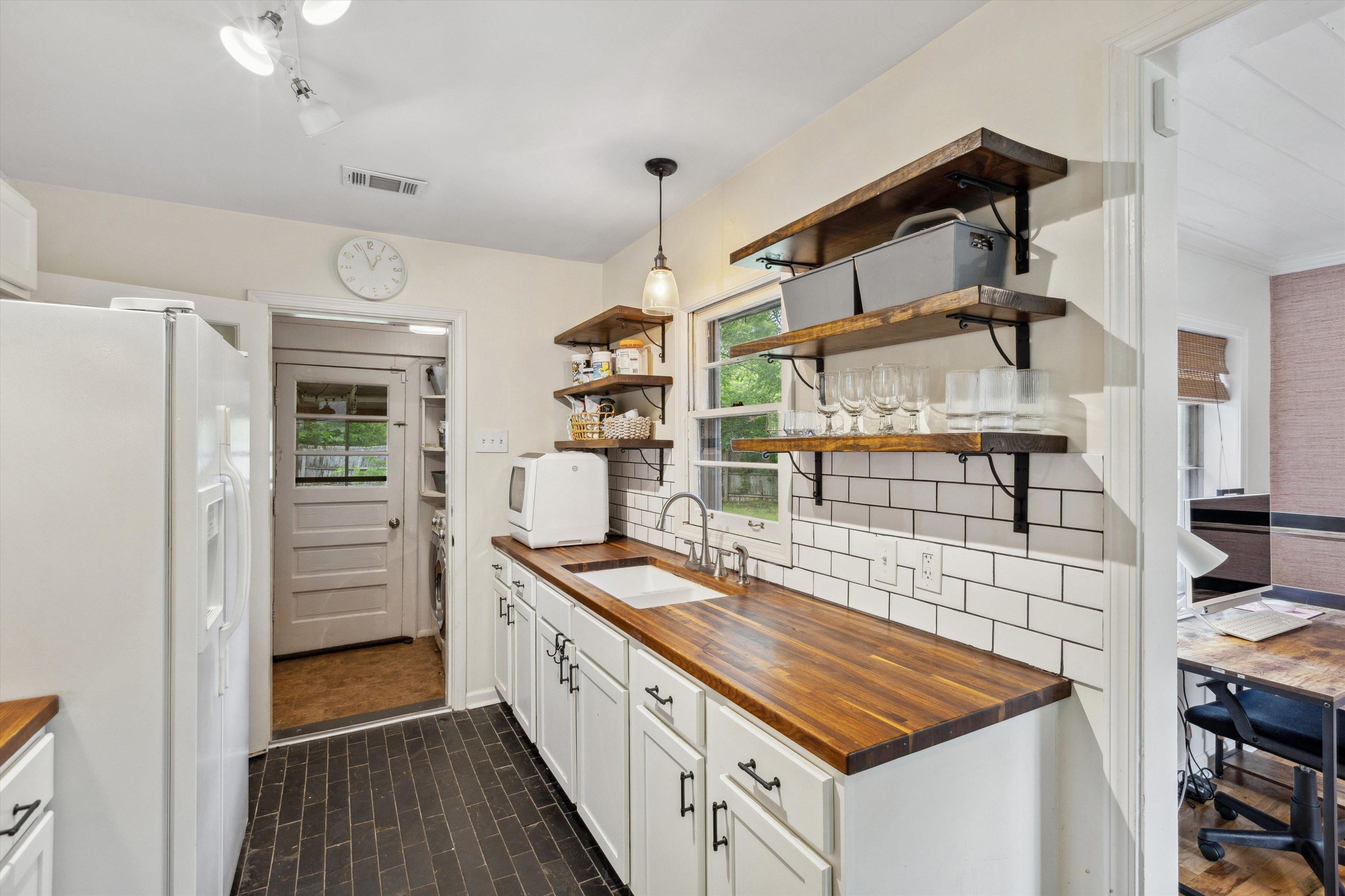 4514 Verne Road Memphis, TN 38117 - Photo 12 of 26 a kitchen that has a sink and a stove