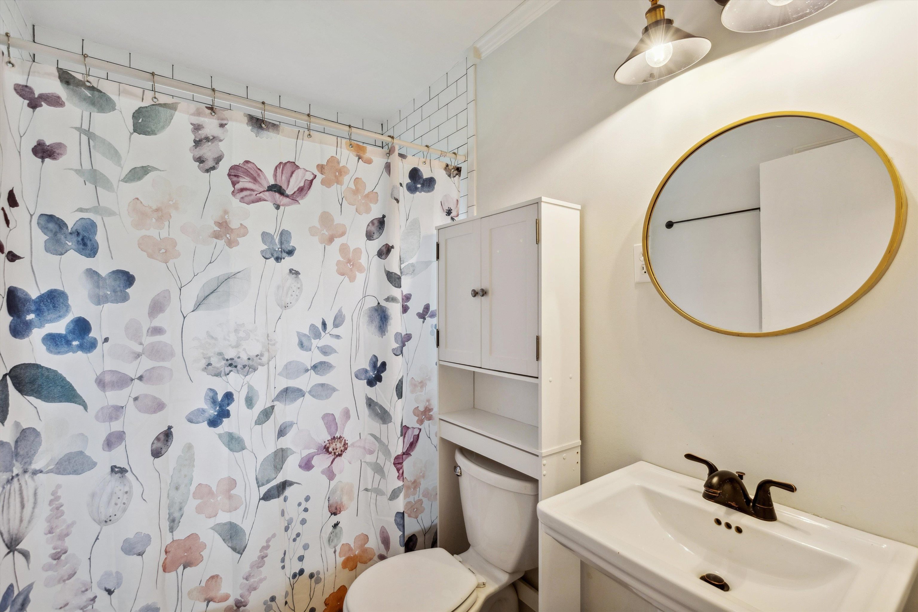 4514 Verne Road Memphis, TN 38117 - Photo 16 of 26 a bathroom with a sink and a mirror