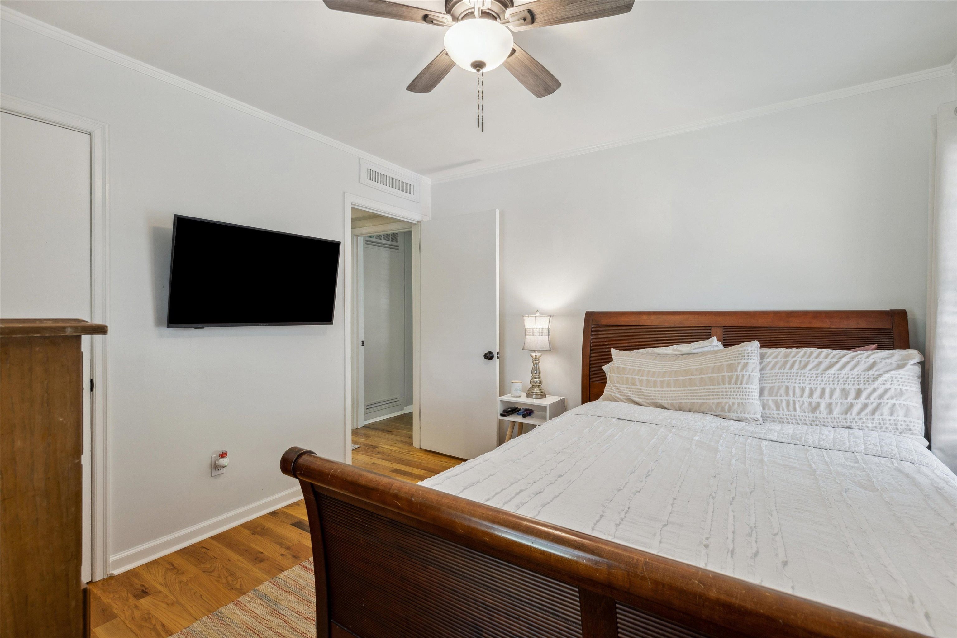 4514 Verne Road Memphis, TN 38117 - Photo 18 of 26 a bedroom with a bed and a flat screen tv