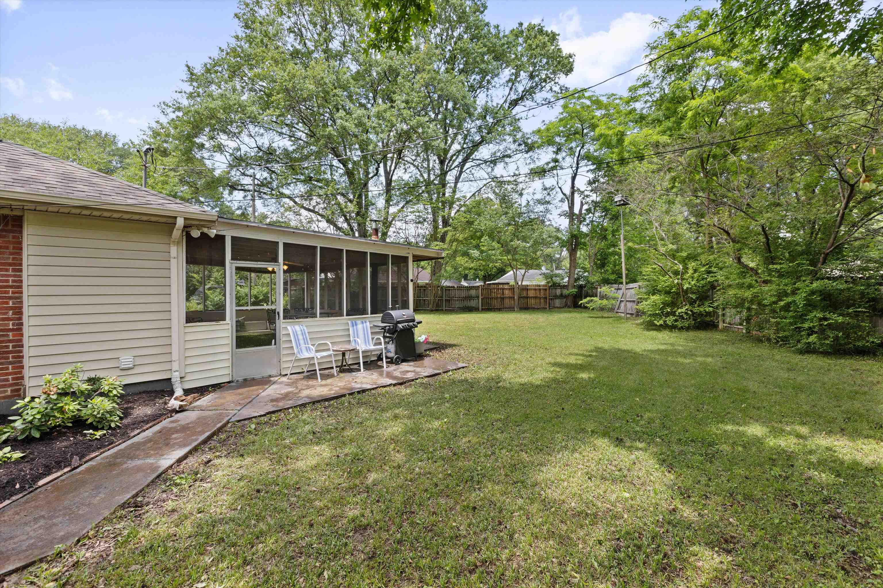4514 Verne Road Memphis, TN 38117 - Photo 23 of 26 a swimming pool with outdoor seating and yard