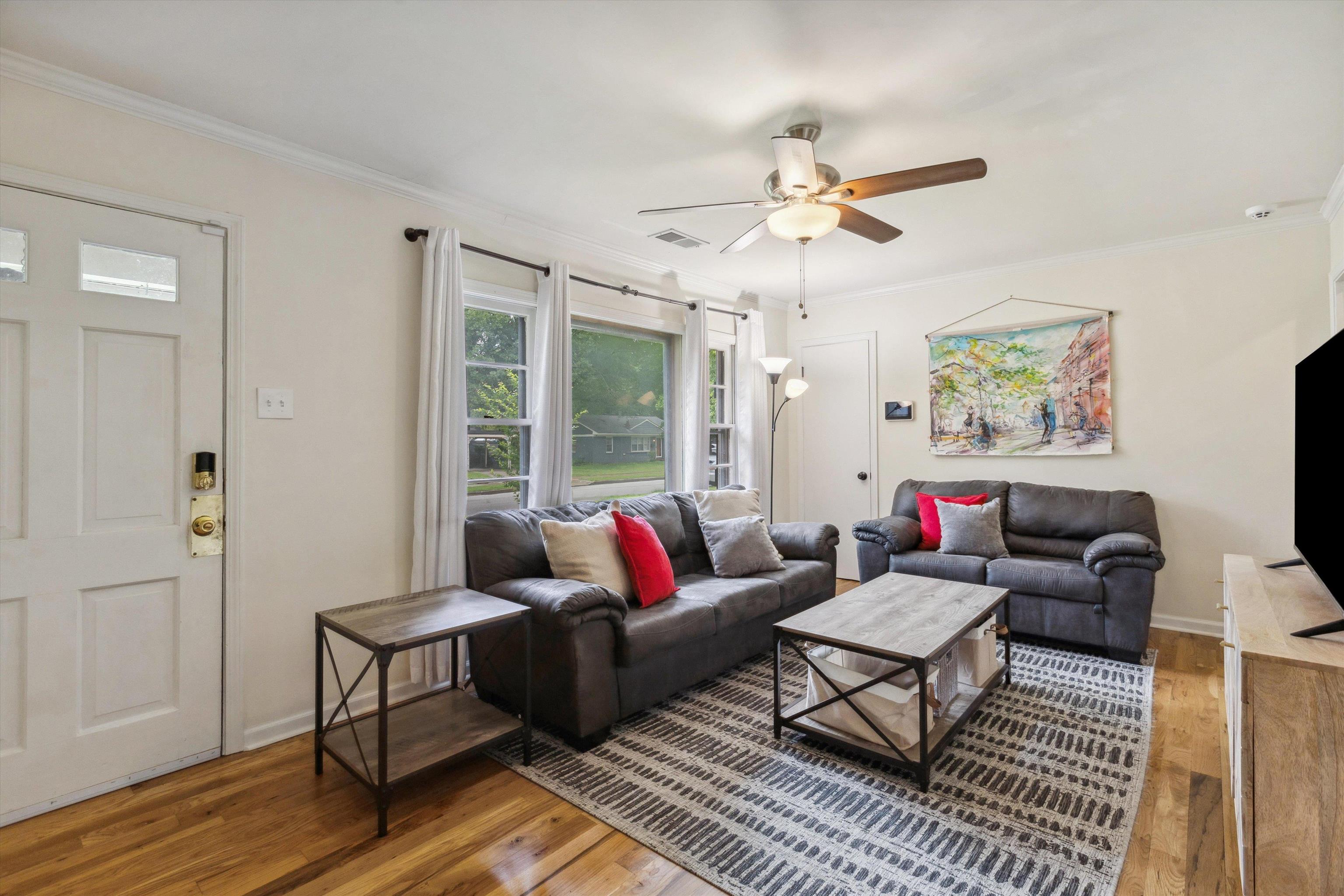 4514 Verne Road Memphis, TN 38117 - Photo 5 of 26 a living room with furniture ceiling fan and a rug