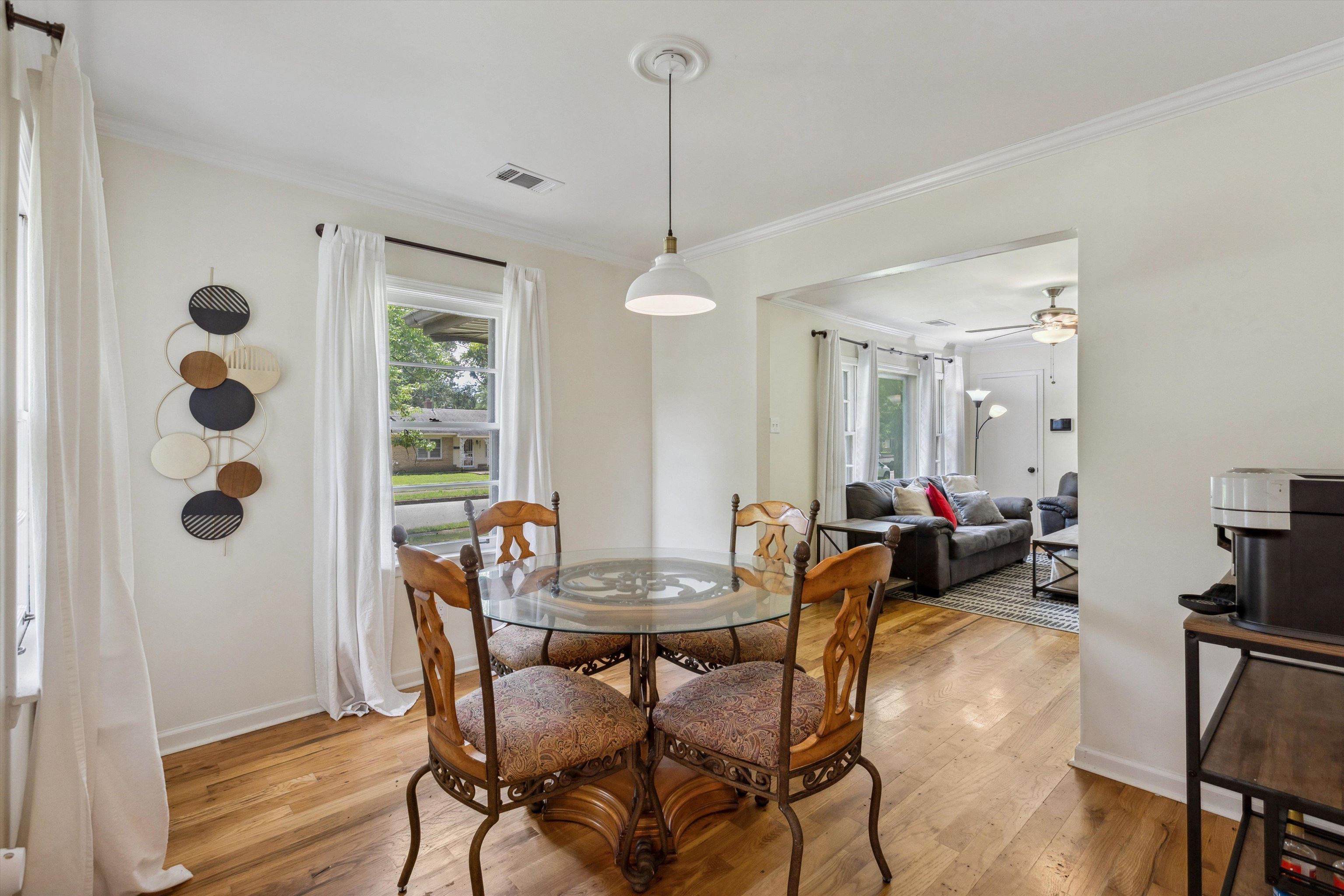 4514 Verne Road Memphis, TN 38117 - Photo 8 of 26 a view of a dining room with furniture window and wooden floor