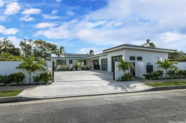 a view of house with outdoor space and garden