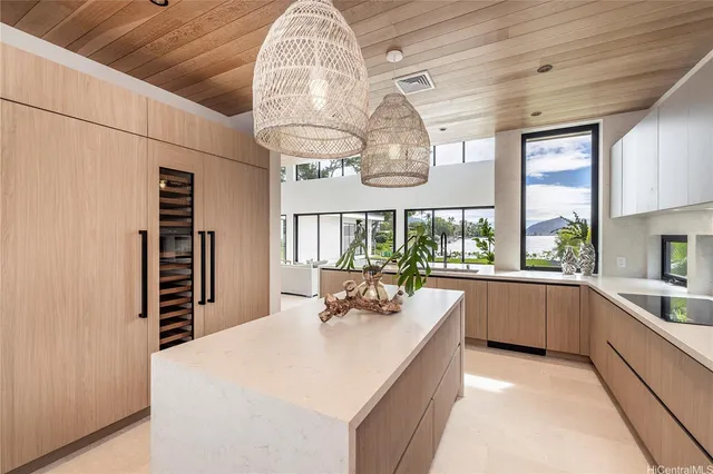 a kitchen with stainless steel appliances a stove a sink and cabinets