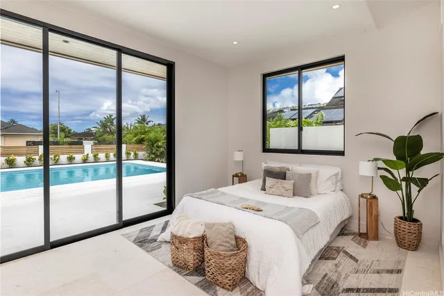 a bedroom with a large bed and a window