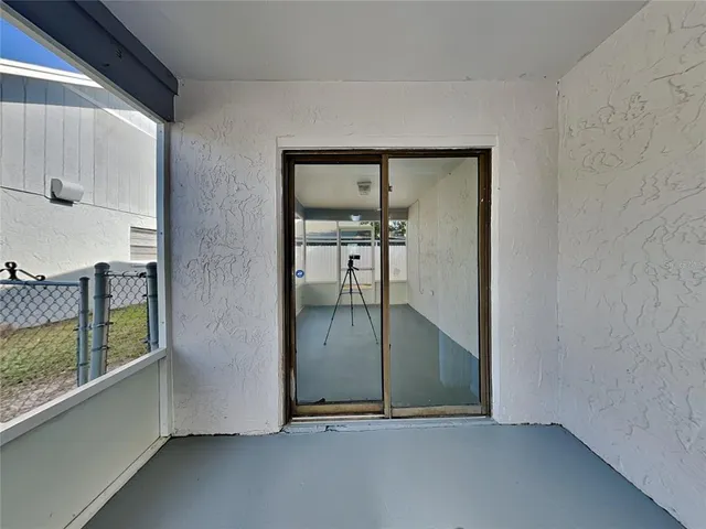 an empty room with mirror