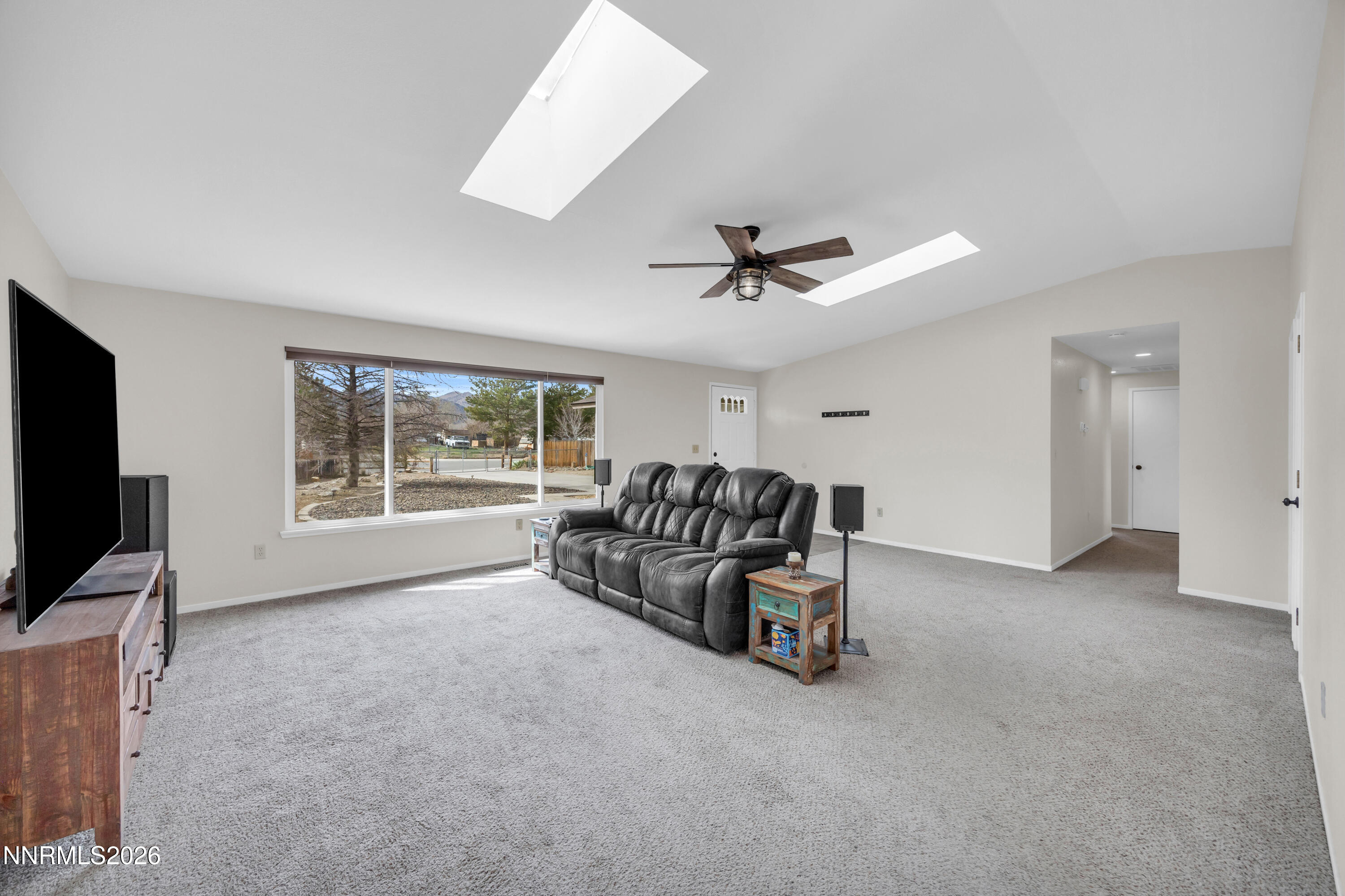702 Ophir Court Dayton, NV 89403 - Photo 12 of 29 a living room with furniture and a flat screen tv