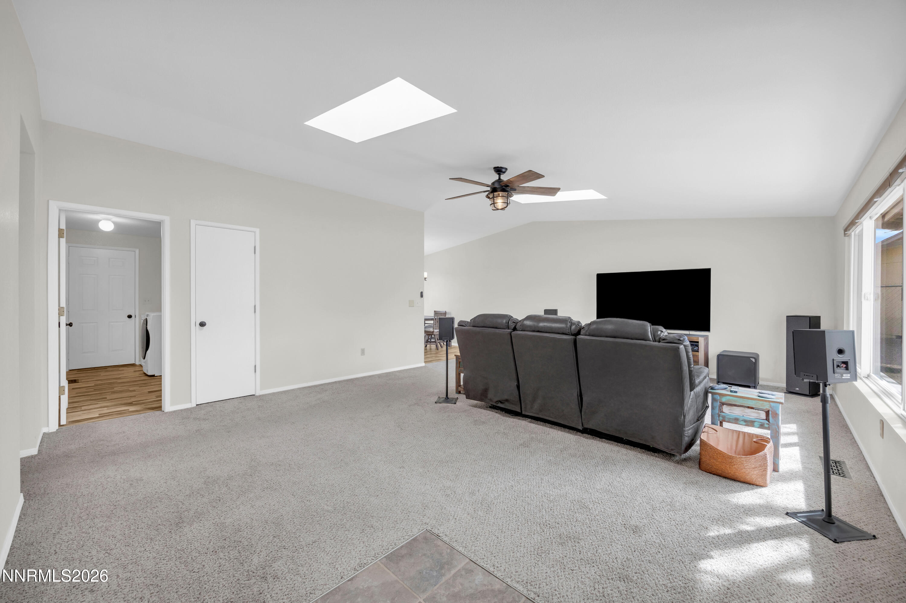 702 Ophir Court Dayton, NV 89403 - Photo 14 of 29 a living room with furniture and a flat screen tv