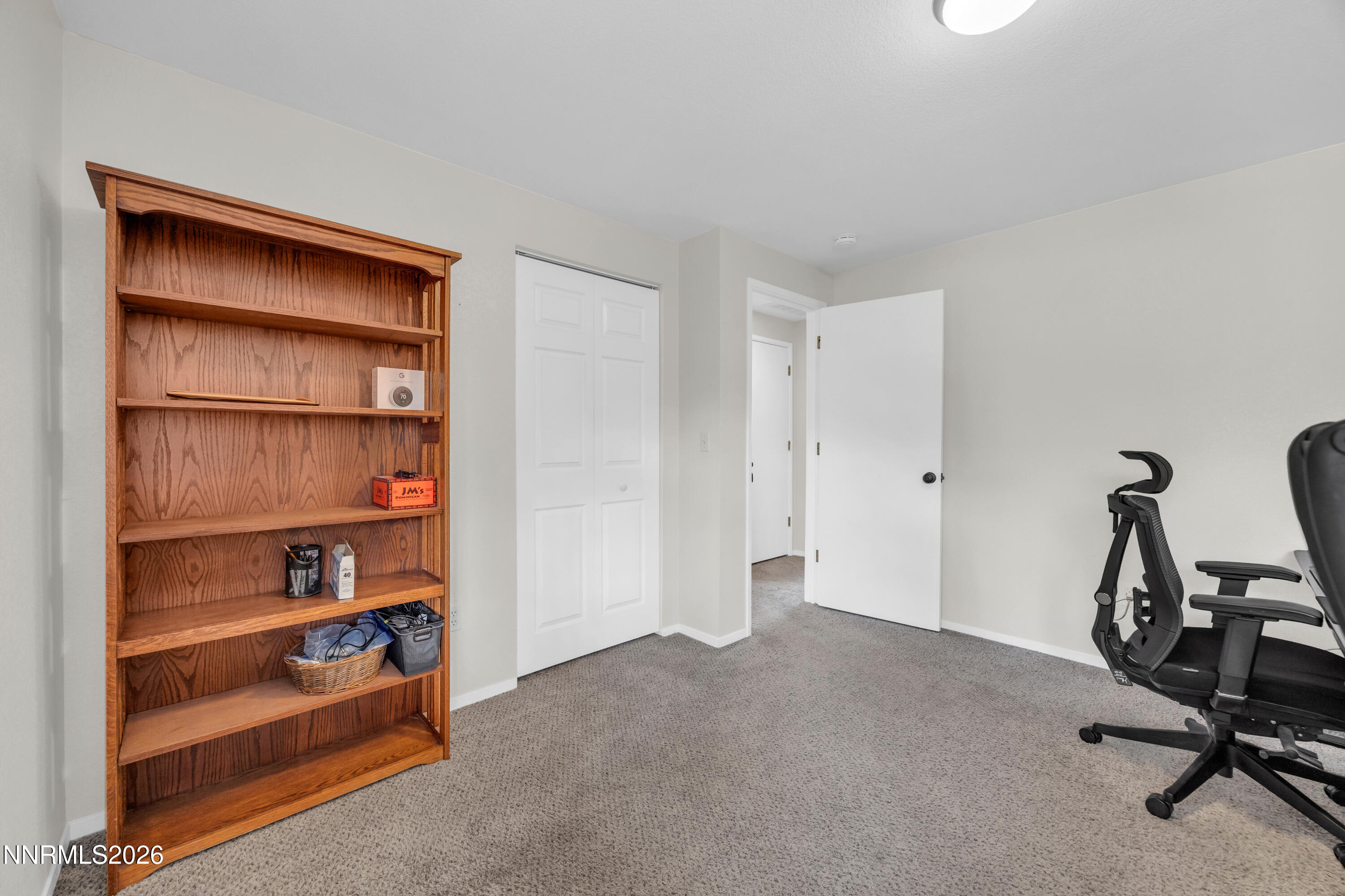 702 Ophir Court Dayton, NV 89403 - Photo 20 of 29 a view of room with empty room and empty shelves