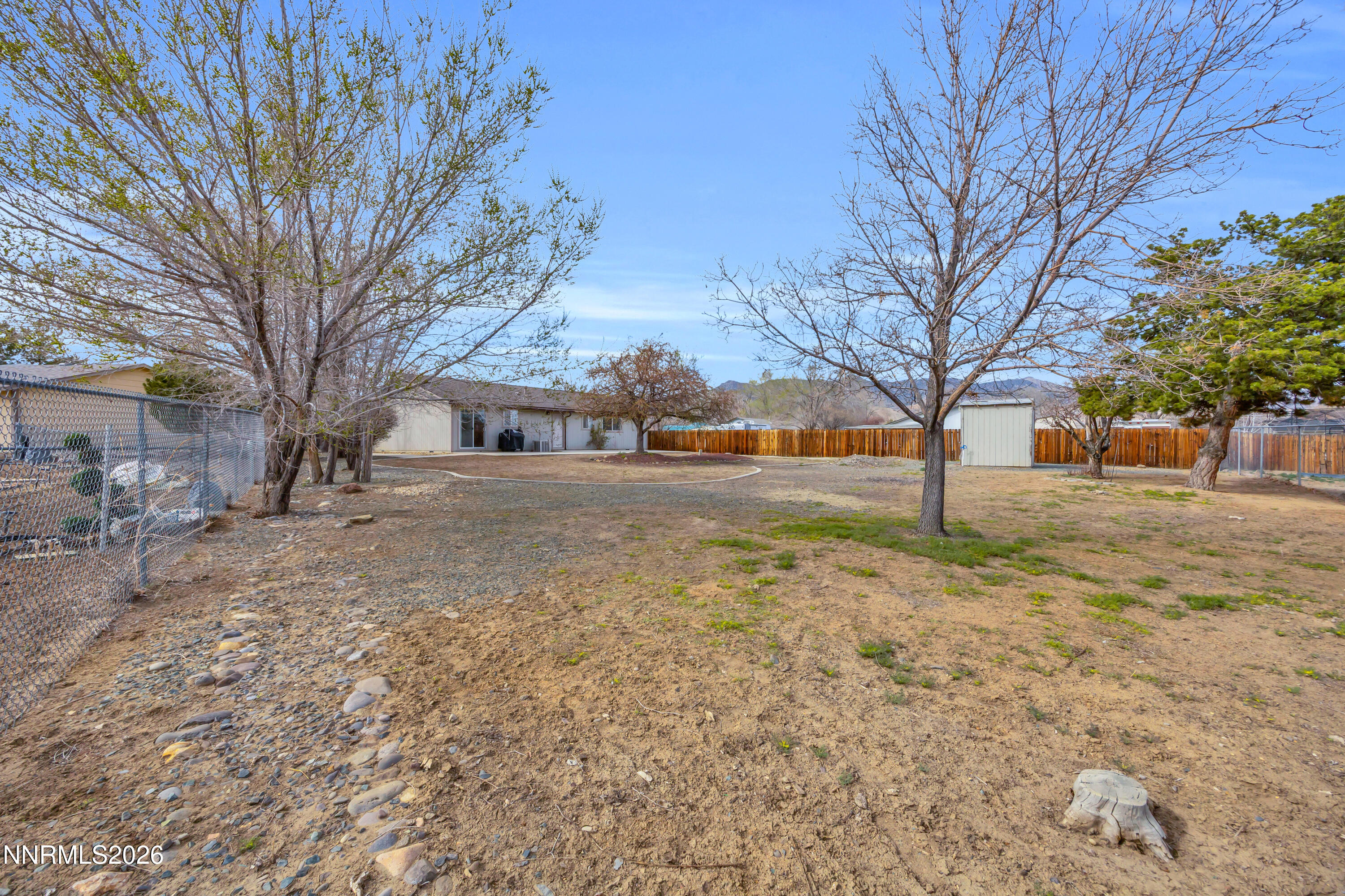 702 Ophir Court Dayton, NV 89403 - Photo 26 of 29 a view of road with covered with trees