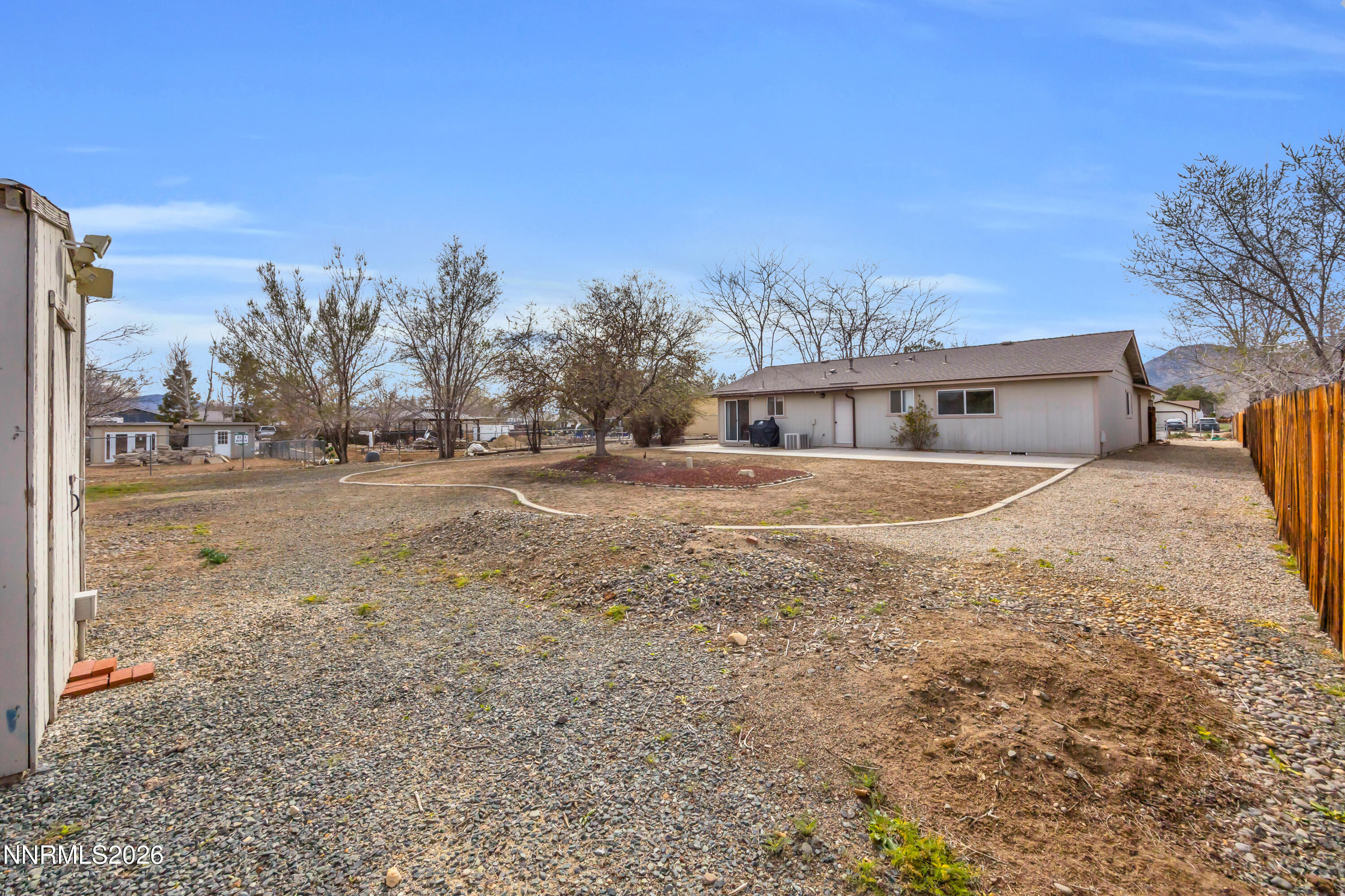702 Ophir Court Dayton, NV 89403 - Photo 27 of 29 a view of house with outdoor space and trees in the background