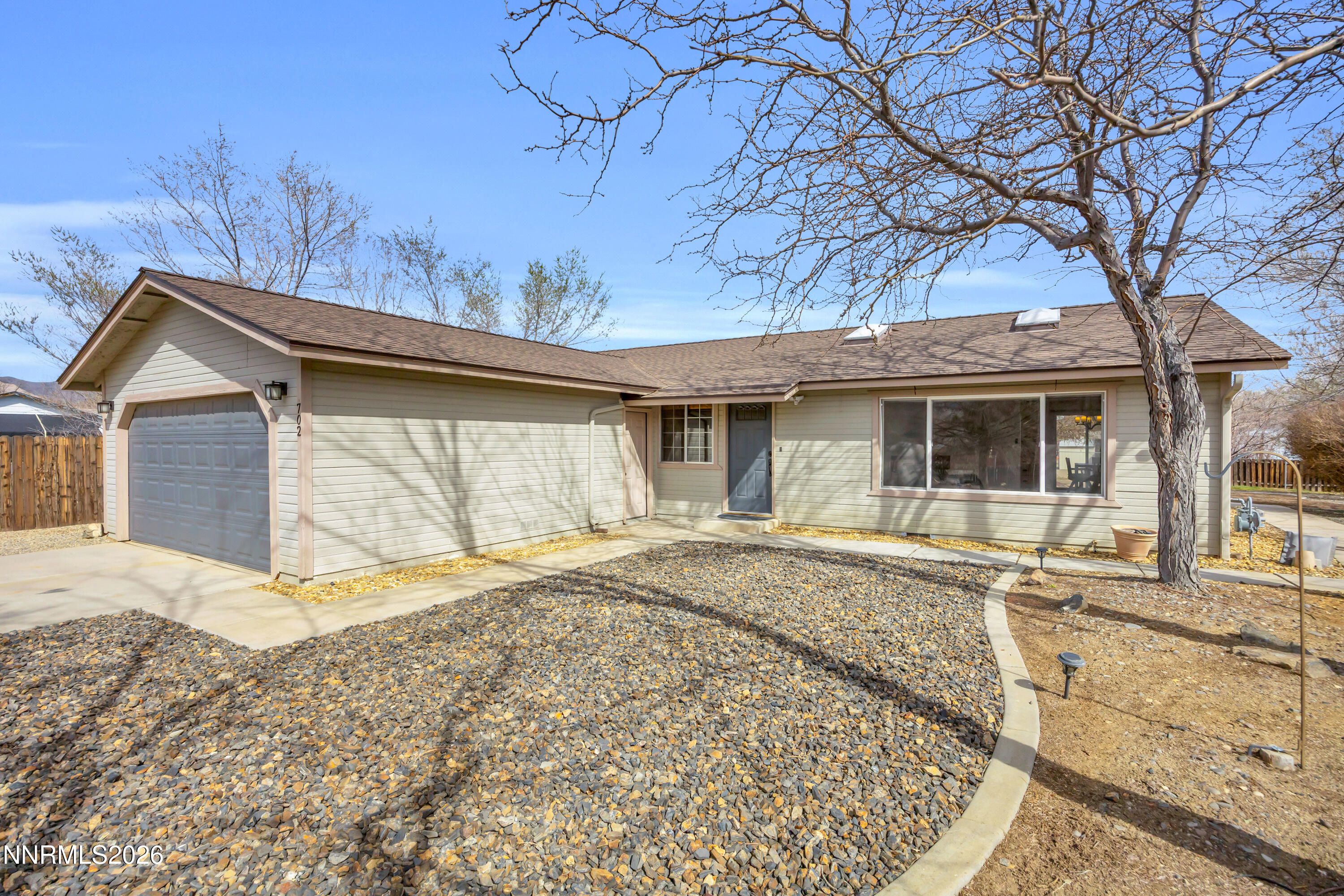 702 Ophir Court Dayton, NV 89403 - Photo 3 of 29 a house with trees in the background