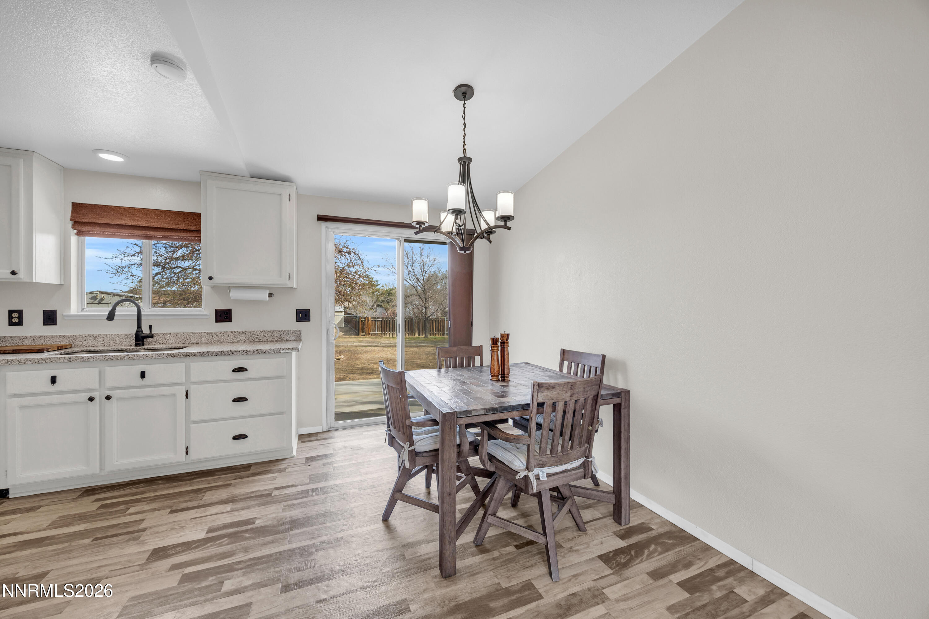702 Ophir Court Dayton, NV 89403 - Photo 10 of 29 a view of a dining room with furniture window and wooden floor