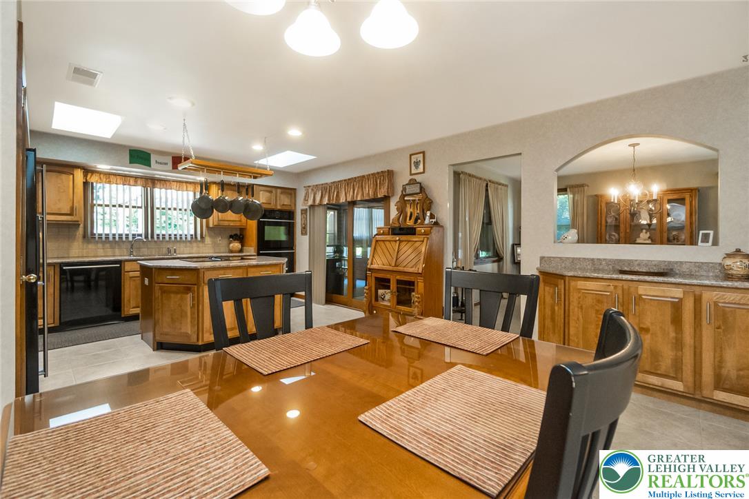 2298 Yost Road Bath, PA 18014 - Photo 18 of 33 Culinary delights await in this bright kitchen with ample counter space and convenient island.