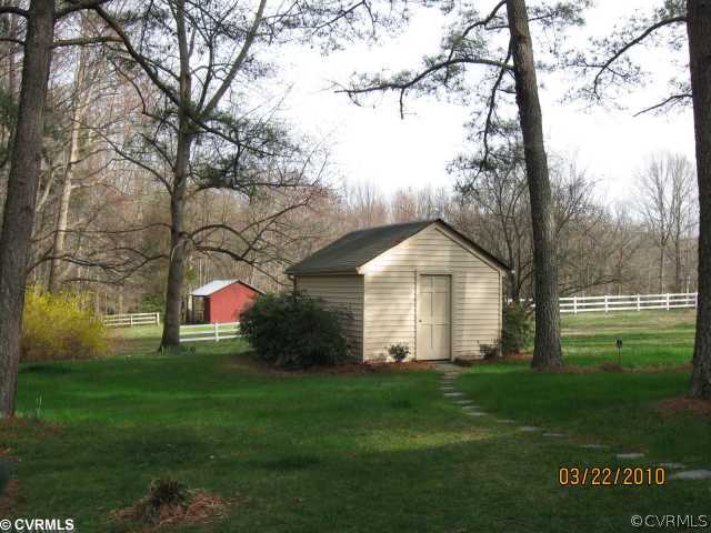 18611 Halifax Road Carson, VA 23830 - Photo 4 of 11 a front view of house with garden