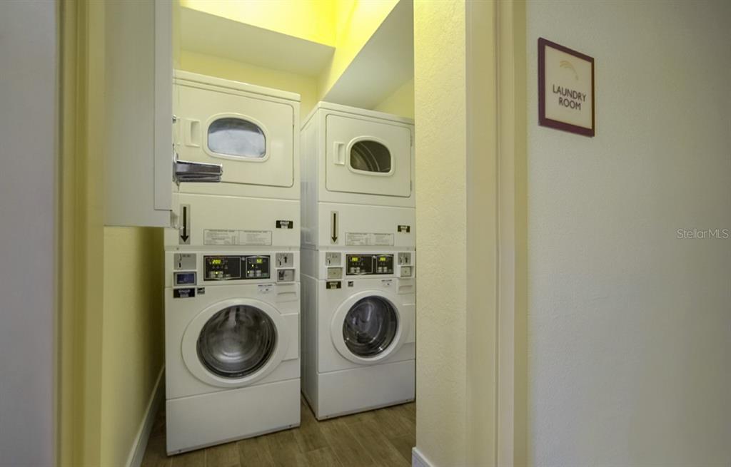 3000 Maingate Lane, Unit 522 Kissimmee, FL 34747 - Photo 4 of 14 a utility room with dryer and washer