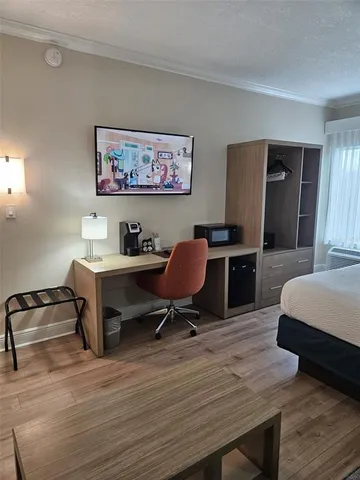 a workspace with furniture and window