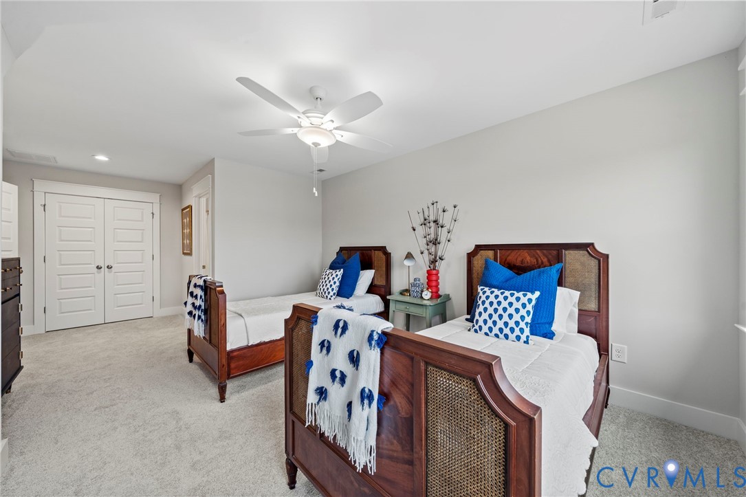 10422 Odette Est Lane, Unit S3 Mechanicsville, VA 23116 - Photo 20 of 27 a bedroom with furniture and a chandelier fan