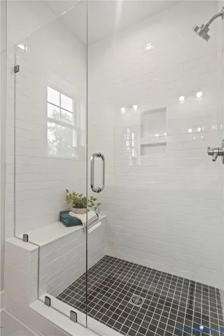 a picture of a room with a mirror and a ceiling fan