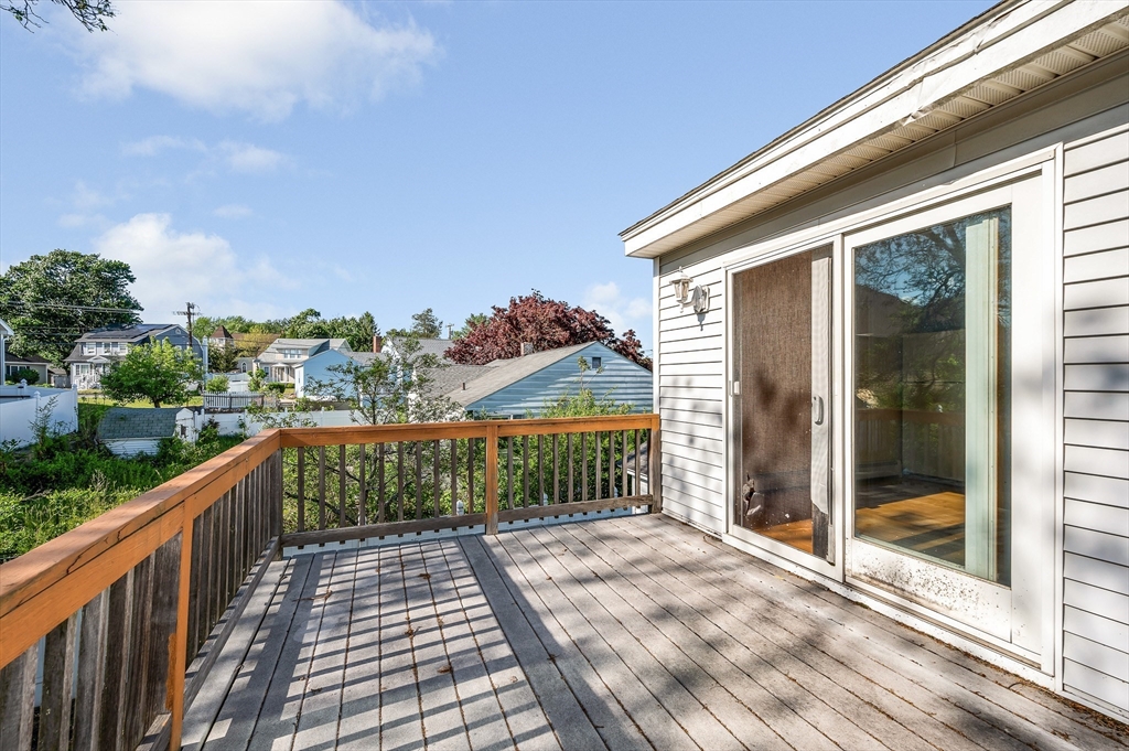 7 Marie Street Methuen, MA 01844 - Photo 32 of 39 a view of a balcony with wooden floor and fence