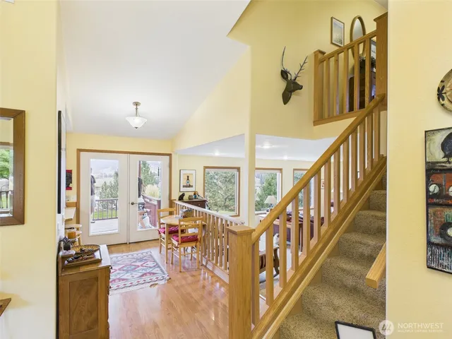 a view of a livingroom with furniture wooden floor and windows