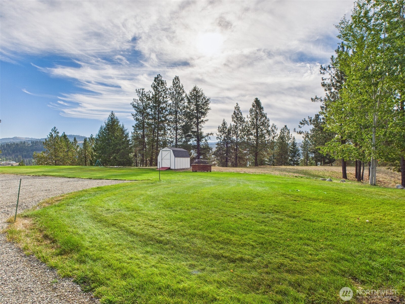 154 West Curlew Lake Road Republic, WA 99166 - Photo 25 of 28 a view of a green field with wooden fence