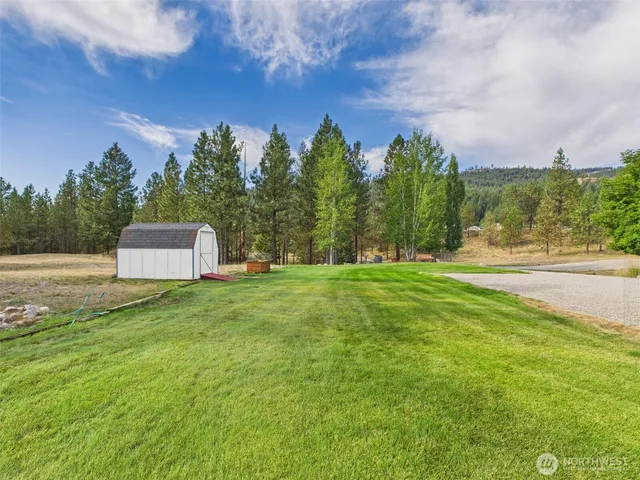 a backyard of a house with lots of green space